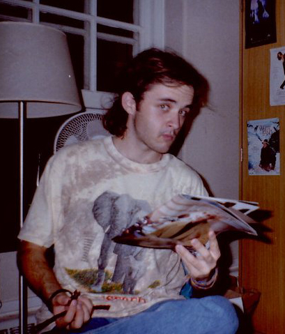 Glenn in 1992, reading magazine and eating Twizzlers